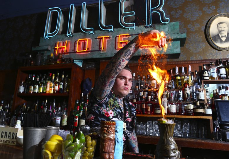 Justin Wojslaw (cq) in action as he mixes up a classic Zombie tiki drink behind the bar at The Diller Room in downtown Seattle. The bar and restaurant resides in the 130-year-old Diller Hotel building. 

HAPPY HOUR - THE DILLER ROOM - TIKI DRINKS - 147370 - 052315